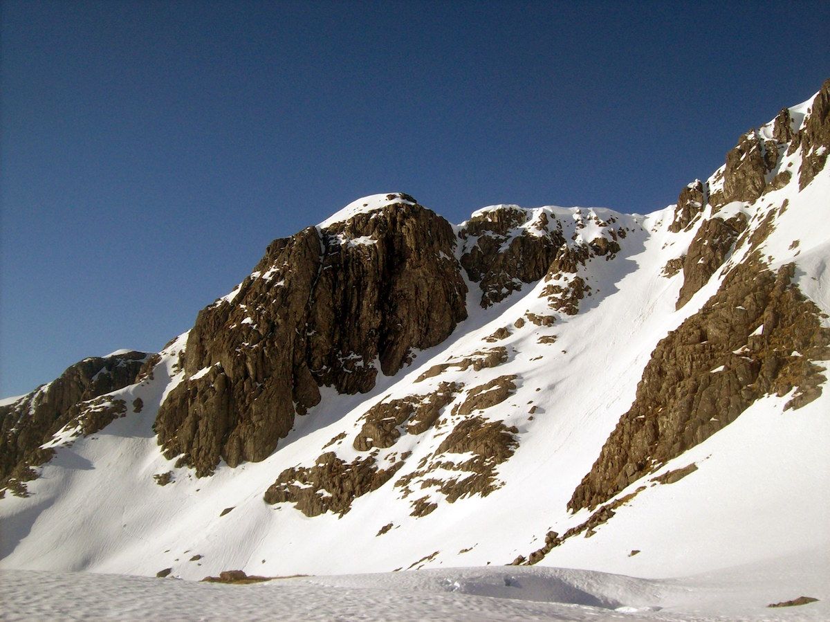 Exploratory climbing on the NE Face of Bidean nam Bian after a night under the stars in the Lost Valley